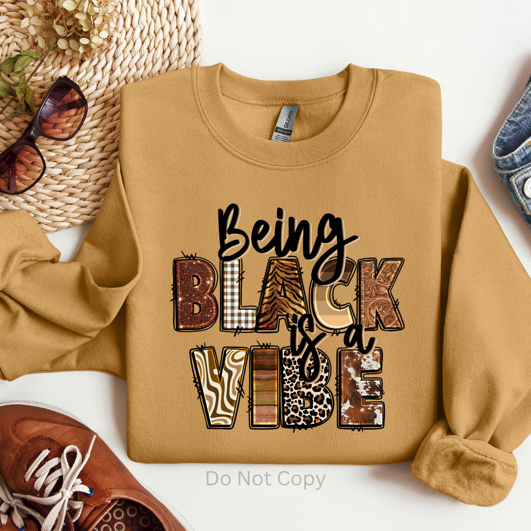 Being Black Is A Vibe DTF (direct to film) print on a sweatshirt