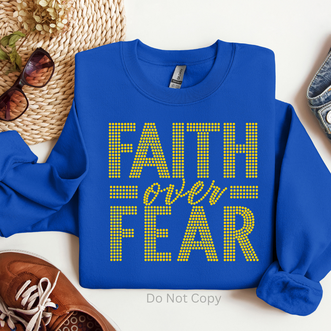 Faith Over Fear Gold Rhinestone Transfer on a tshirt